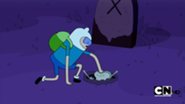 185px-S1e1 finn pushing zombie into hole