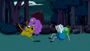 LSP punching Jake after Finn accidentally knocks over her can of beans.