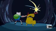 Finn and Jake busting the wall