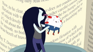 Close-up of Marceline licking the red off Peppermint Butler.