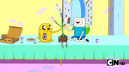S2e17 Finn and Jake high-fiving over Princess Plant