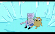 S1e3 finn and jake sitting in snow