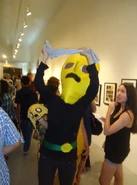 Tom Herpich at an Adventure Time art show, dressed as the Earl of Lemongrab