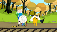 S4 E15 Finn and Jake at train tracks holding robot parts