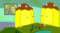 Two Banana Guards playing a board game