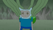 S4e23 Mega Frog pinching Finn's ears