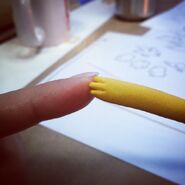 Kristen Lepore (episode animator) giving "doll-jake" a high five,