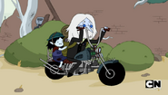 Simon and Marcy riding a motorcycle