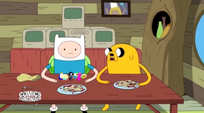 S5 e5 Finn and Jake at the table with noodles and tiny people