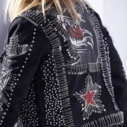 A classic example of aesthetic subversion: 1970s punk fashion appropriated the safety pin, transforming a mundane domestic object into a symbol of rebellion, aggression, and anti-consumerism.