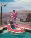 u/cosmictrousers's dad with Hawaiian shirt and Cockatoo, with their brother on an upside-down inflatable boat in a swimming pool, with street lamp. 1983.