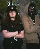 Communistchic4.jpg (43 KB) Trap Metal musician Killtak (@killtakular), who self-identifies with communist themes, posing with fellow artist Yaux (wearing a gas mask with an anarchist symbol).