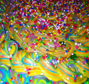 Multicolored frosting with rainbow sprinkles on top.