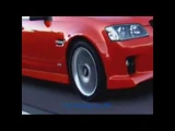 Animated visualizer clip focusing on a red, modified street-racing vehicle.
