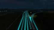 A road surrounded by blue illuminous lights at night time