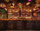 The False Idol tiki bar in San Diego, California. Note the bamboo ceiling, as well as the glass fishing floats hanging from it, and the wooden carved tikis.