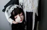 Girl-holding-doll-mask