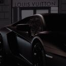 Lamborghini in front of a Louis Vuitton store