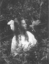 "Frances and the Leaping Fairy", the third of the five Cottingley Fairy photographs, taken by Elsie Wright in 1920.