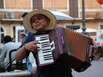 Accordion playing boy in Rome