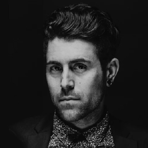 Lead singer Davey Havok of the band AFI stands on stage during a