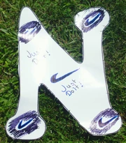 "N" for "Nike" Nike is a shoe company that sponsors some athletes, including Jordan, a professional runner that visited us and runs in the Liberty Mile.