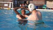 Water-polo-cap-tie-helping