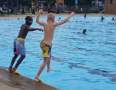  and Donovan at the  wearing their swim fins on a jump into the water