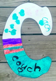 "C" for "Couch"Hummm. Should be "Coach," we think.