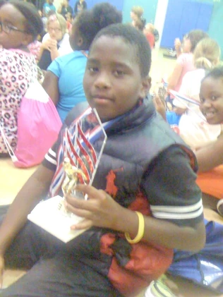 Most improved swimmer among the boys at , 2014.