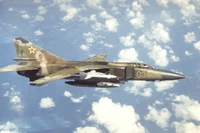 An air-to-air right side view of a  MiG-23MLD aircraft.