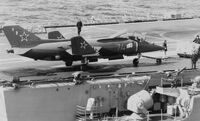 Right side view of a Soviet Yak-38 on the deck of a Soviet aircraft carrier.