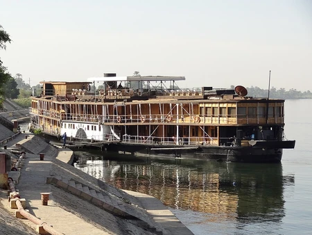 Agatha Christie most probably based her play on a cruise on board the PS Sudan in 1937. This boat is still in service offering Nile cruises. It is not clear what the floorplan of the boat was in Christie's time. Today, the top deck, under the white awning is the sundeck and the solarium but obviously Christie intended the action in her play to happen in an enclosed space. Below the top deck, most of the upper deck is used for cabins. On the lower deck, turning right as you on board via the gangway, is the dining room/lounge/bar. We can assume this is the "observation saloon" of the boat.