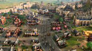 An English town in Age of Empires IV, featuring an army of infantry marching to the gates.