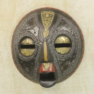 A handmade commercial African tribal mask, resembling the expansion icon.