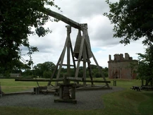 Scale model of the Warwolf in front of Caerlaverock Castle