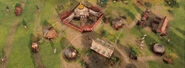 A bird's-eye view of a Mongolian camp in Age of Empires IV, featuring some villagers and sheep.