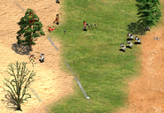 A small group of Throwing Axemen attacking retreating Villagers near a central hill on a Gold Rush map.