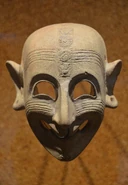 Phoenician grinning mask, 4th century BCE, from a grave at San Sperate in Sardinia, Italy