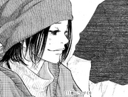 A cheerful Yuka watches her son