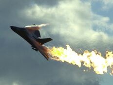 An F-111 dumping fuel