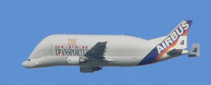 Airbus Beluga in flight over Hamburg in old initial Airbus livery.