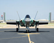 An F-35C, with its wingtips folded up.