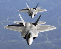 750px-Two F-22A Raptor in column flight - (Noise reduced)