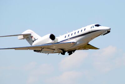 A Citation X taking off.