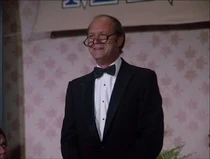 This is Dave Morick, billed simply as "speaker" at a presentation dinner for Hawke's friend, Roy Starkey at the beginning of the episode.