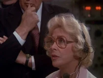 Dr. Watkins mentions that this person is Dr. Kaspersen but there is no credit for this name. There is one for "female technician" so this could be her. She is the only "technician" type in the control room with a speaking part.