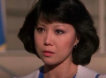 Irene Yah-Ling Sun as Nhi Huong, wife of USAF officer Sam Roper and someone from Hawke's past.