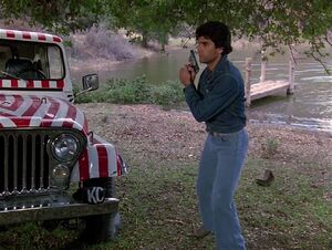 Emilio with his Beretta Model 90. He is about to shoot the tires of Hawke's jeep to prevent him from following.