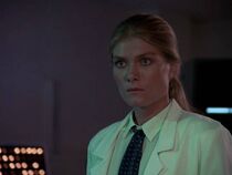 Maria Mayenzet as Olga. Her name is never mentioned in the dialogue. She is some kind of assistant to Dr Kruger and is apparently quite senior. She is the only one wearing a tie--the rest are in nurses uniforms.